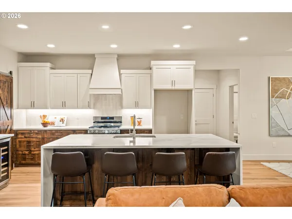 a kitchen with a sink cabinets and window
