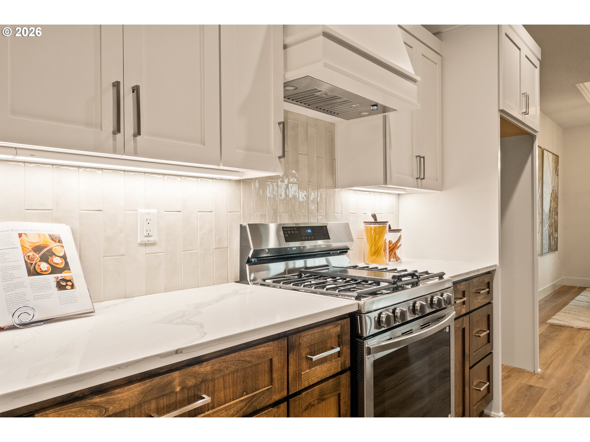 315 Northeast Clay Street Sublimity, OR 97385 - Photo 15 of 42 a kitchen with stainless steel appliances a stove a sink and cabinets