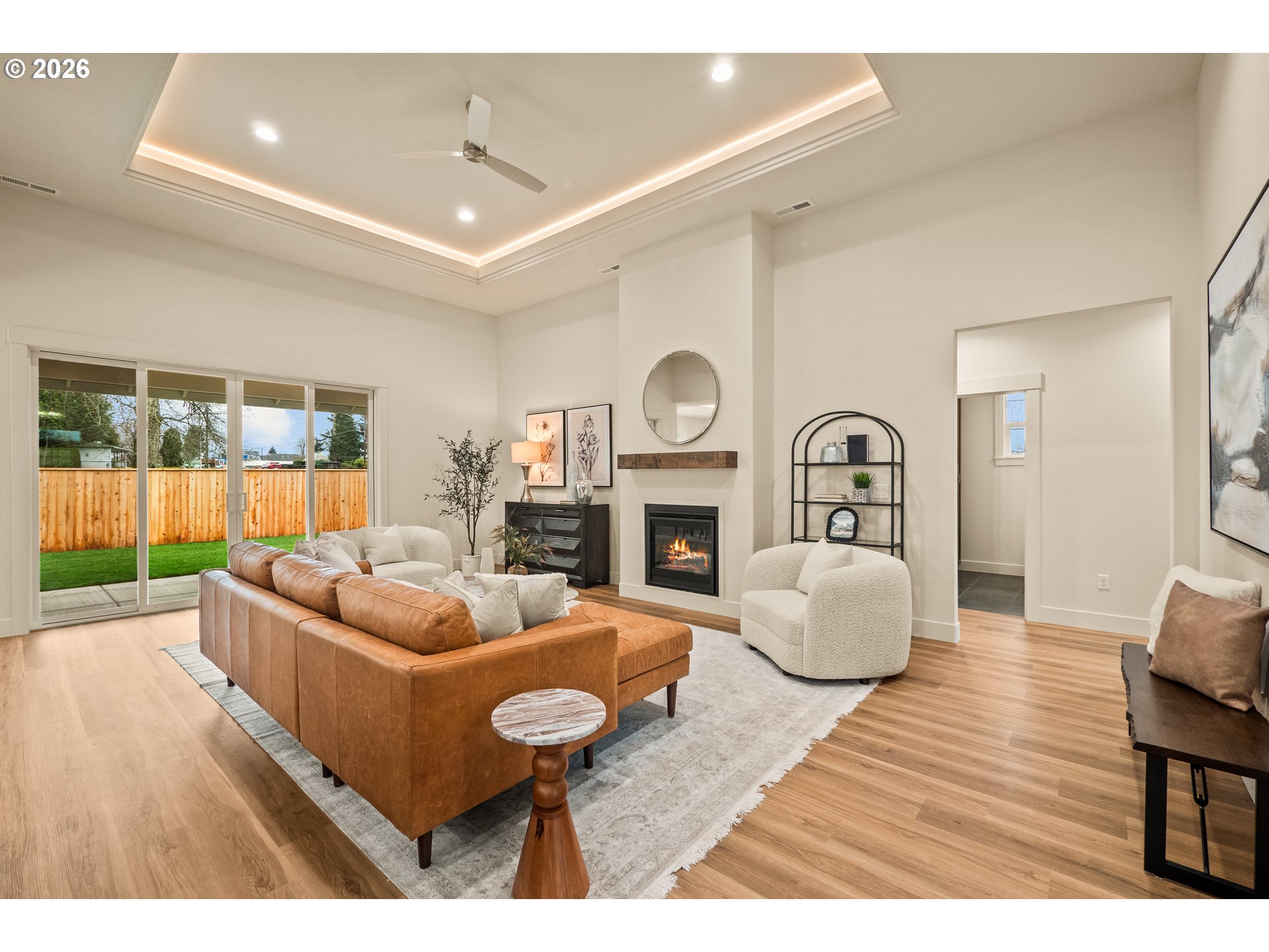 315 Northeast Clay Street Sublimity, OR 97385 - Photo 3 of 42 a living room with furniture a fireplace and a large window