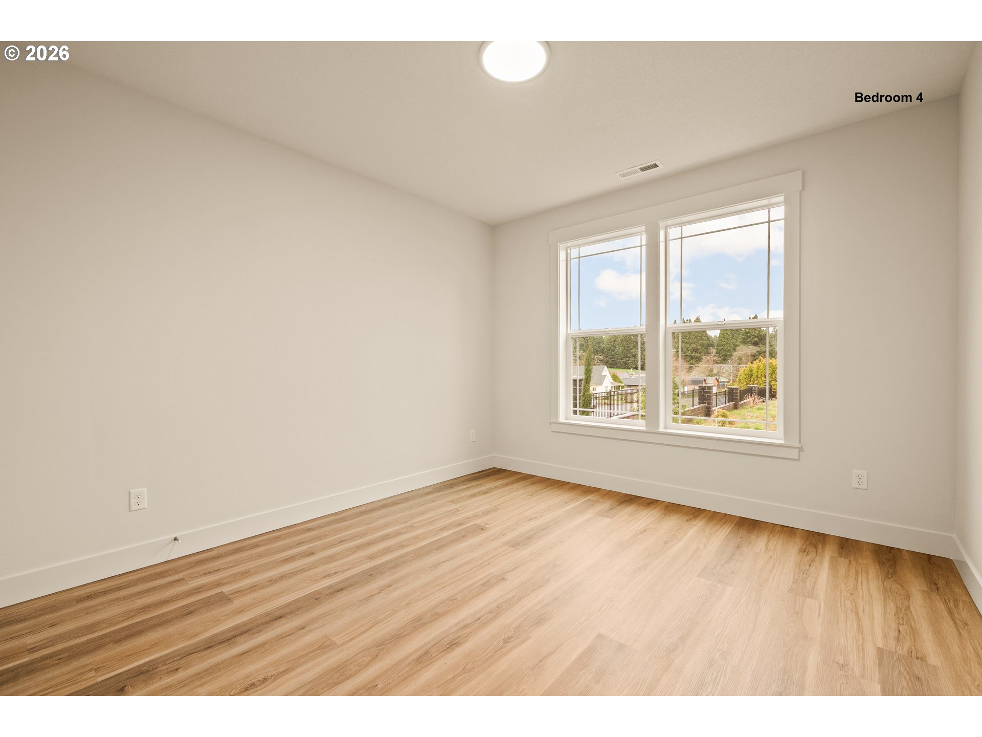315 Northeast Clay Street Sublimity, OR 97385 - Photo 31 of 42 a view of an empty room with wooden floor and a window