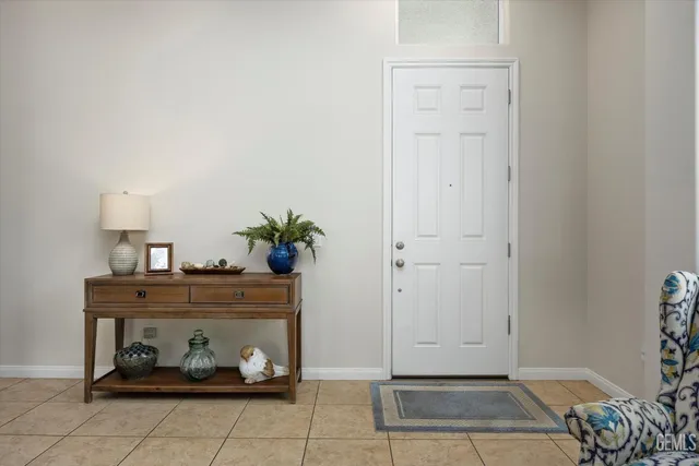 a room with a table and a potted plant