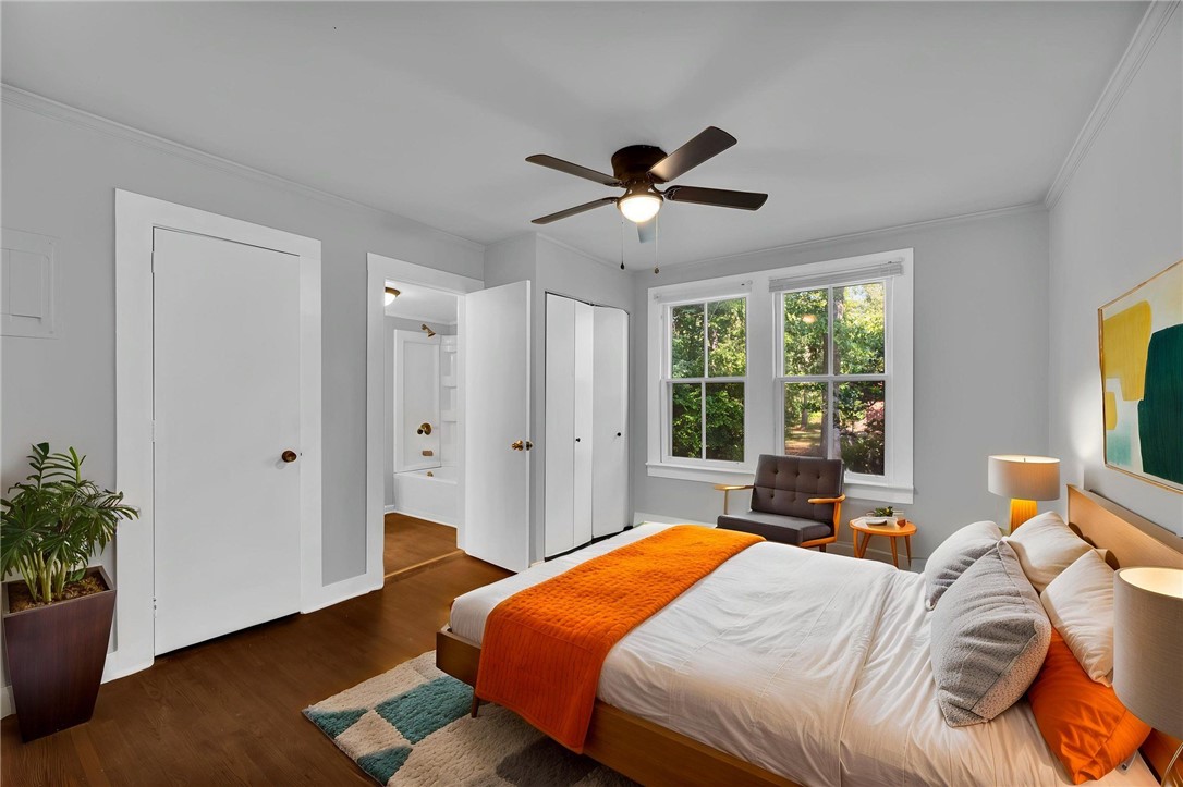 403 Lewis Street Anderson, SC 29624 - Photo 31 of 35 Gleaming hardwood floors and classic crown molding define this bedroom suite with garden views.