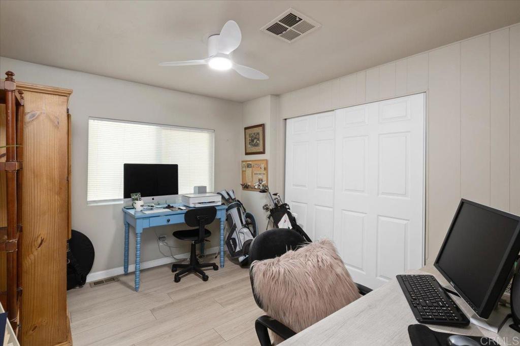 4660 North River Road, Unit 150 Oceanside, CA 92057 - Photo 14 of 23 a view of a workspace with furniture and a window