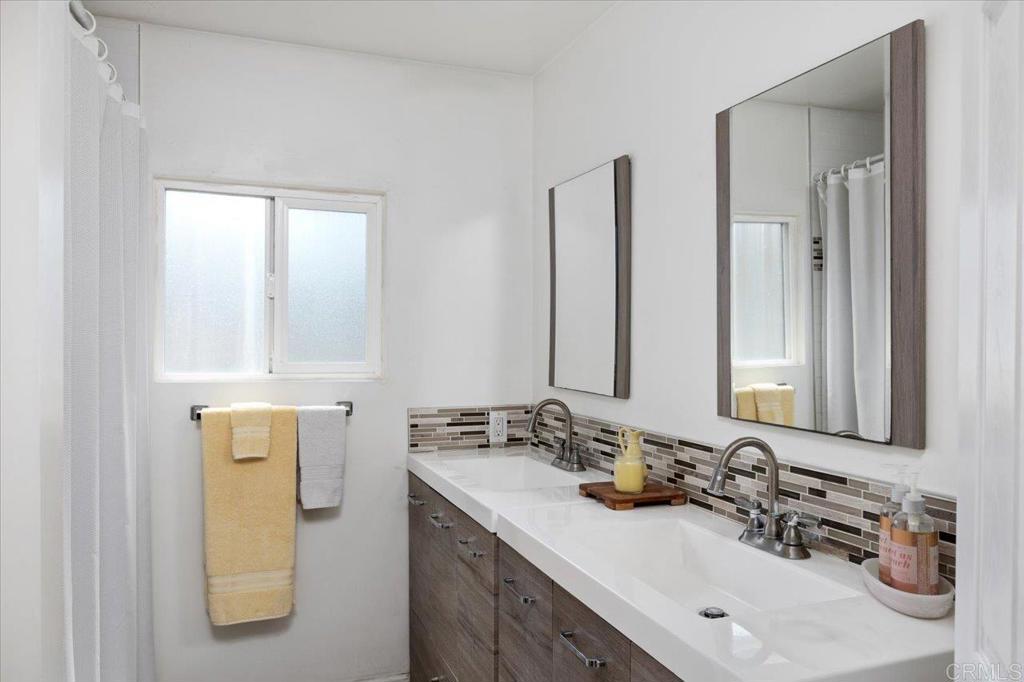 4660 North River Road, Unit 150 Oceanside, CA 92057 - Photo 15 of 23 a bathroom with a sink and a mirror