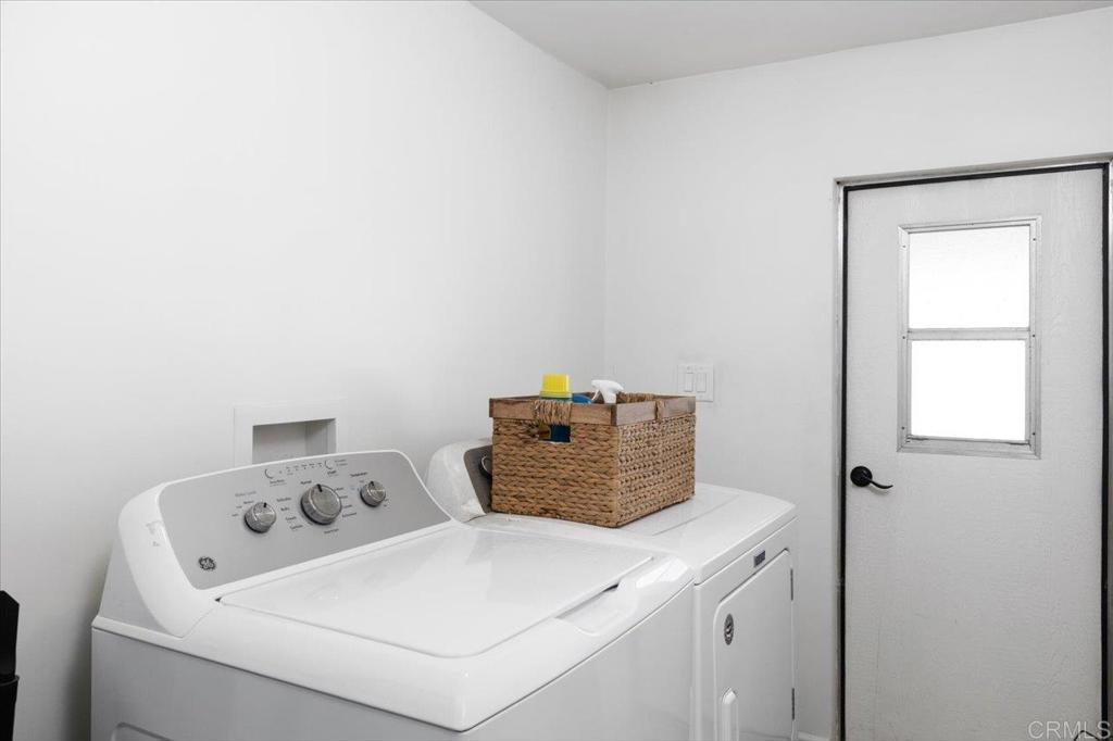 4660 North River Road, Unit 150 Oceanside, CA 92057 - Photo 16 of 23 a utility room with dryer and washer