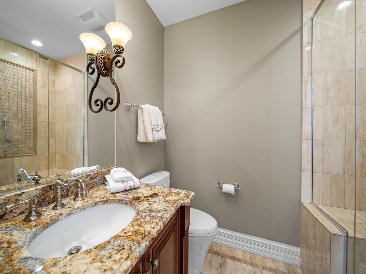700 Greenwood Road Northbrook, IL 60062 - Photo 40 of 81 a bathroom with a granite countertop sink a toilet and shower