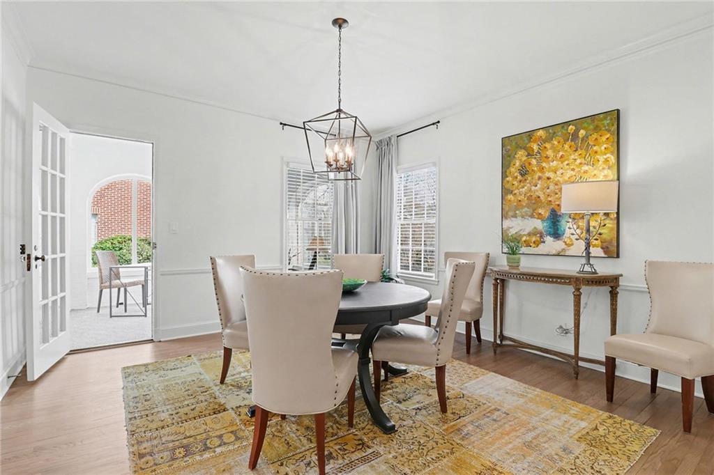 1746 Johnson Road Northeast Atlanta, GA 30306 - Photo 12 of 45 a dining room with furniture a chandelier and wooden floor