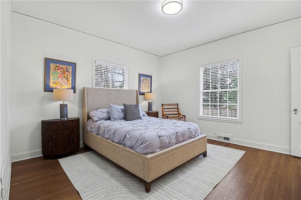 1746 Johnson Road Northeast Atlanta, GA 30306 - Photo 21 of 45 a bedroom with a bed lamp and a window