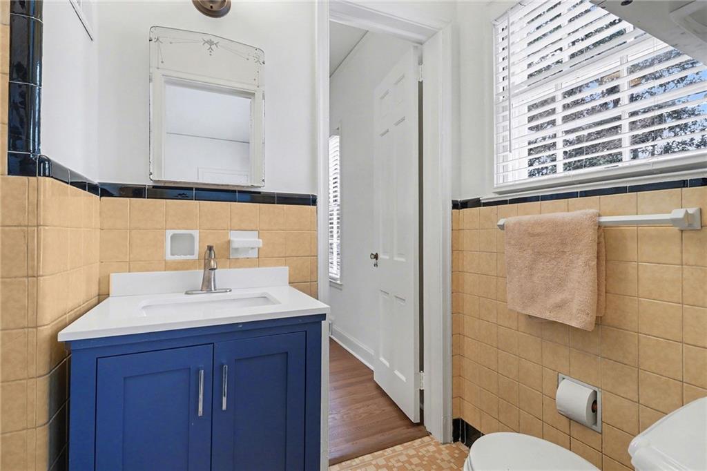1746 Johnson Road Northeast Atlanta, GA 30306 - Photo 23 of 45 a bathroom with a sink vanity mirror and toilet