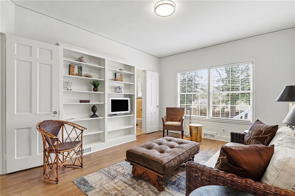 1746 Johnson Road Northeast Atlanta, GA 30306 - Photo 25 of 45 a living room with furniture a rug kitchen view and large windows