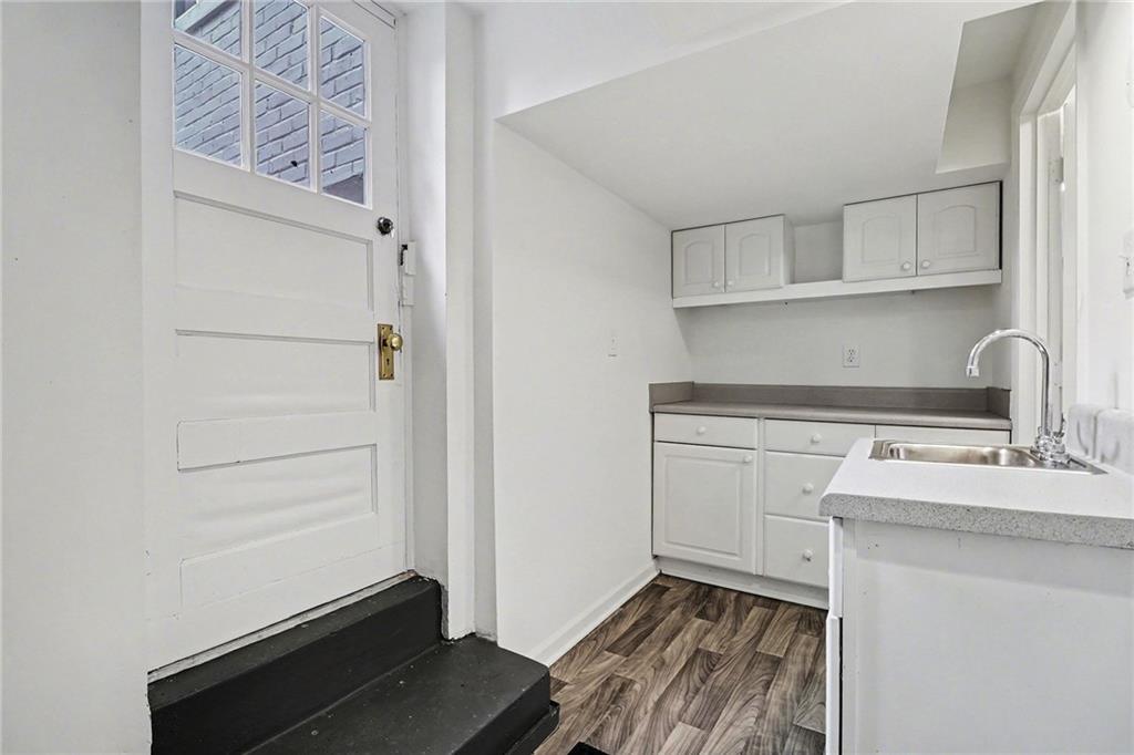 1746 Johnson Road Northeast Atlanta, GA 30306 - Photo 37 of 45 a kitchen with a sink and cabinets