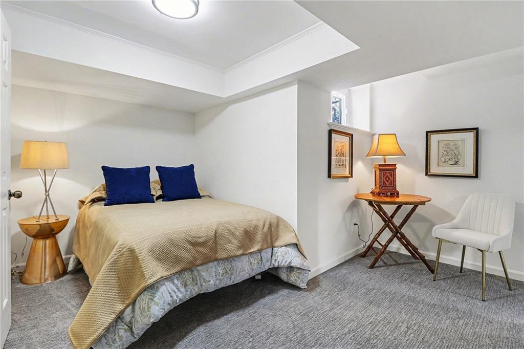 1746 Johnson Road Northeast Atlanta, GA 30306 - Photo 38 of 45 a bedroom with a bed a table and chair