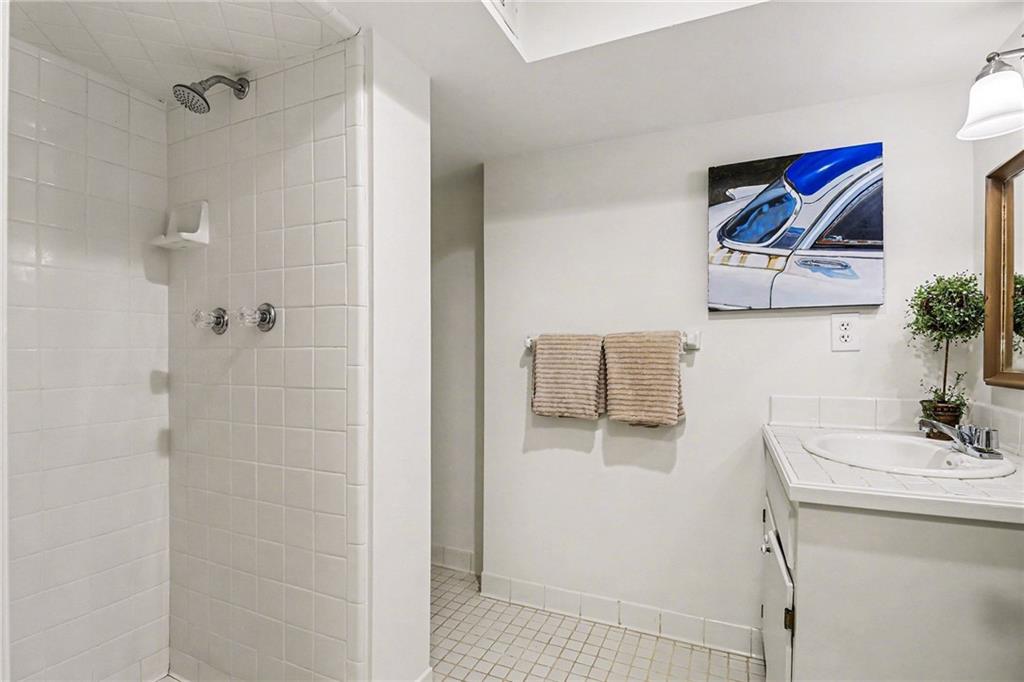 1746 Johnson Road Northeast Atlanta, GA 30306 - Photo 39 of 45 a bathroom with a shower and a sink