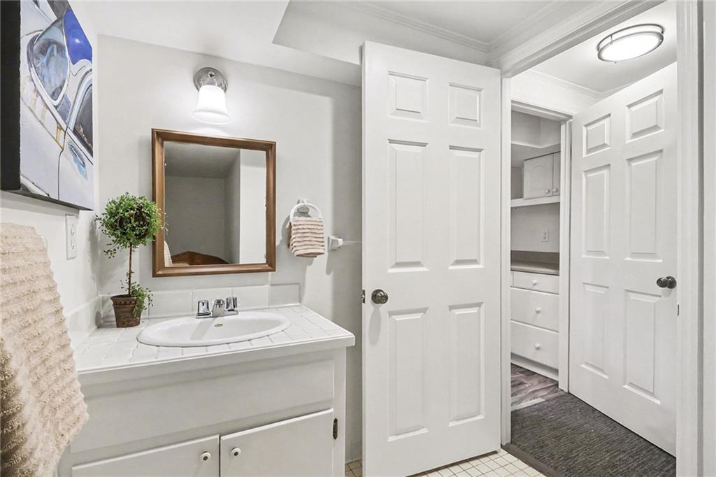 1746 Johnson Road Northeast Atlanta, GA 30306 - Photo 40 of 45 a bathroom with a sink and a mirror