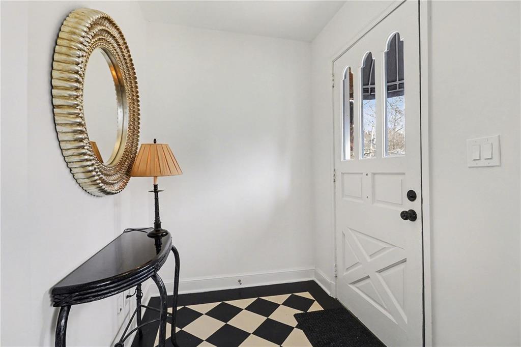 1746 Johnson Road Northeast Atlanta, GA 30306 - Photo 7 of 45 a bathroom with a sink a mirror and a shower