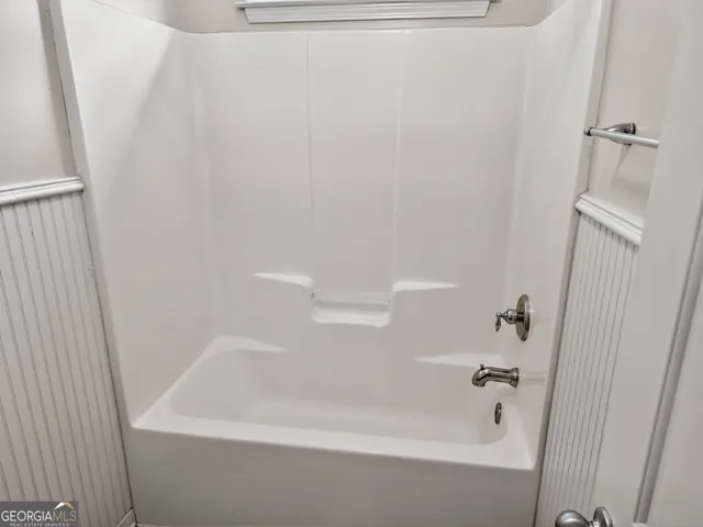 a close view of a bathtub in bathroom