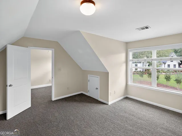 a view of room with window and entryway