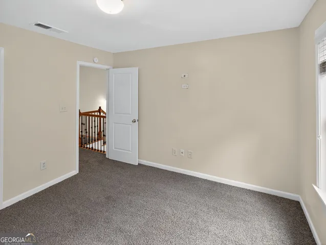 a view of an empty room and fire place