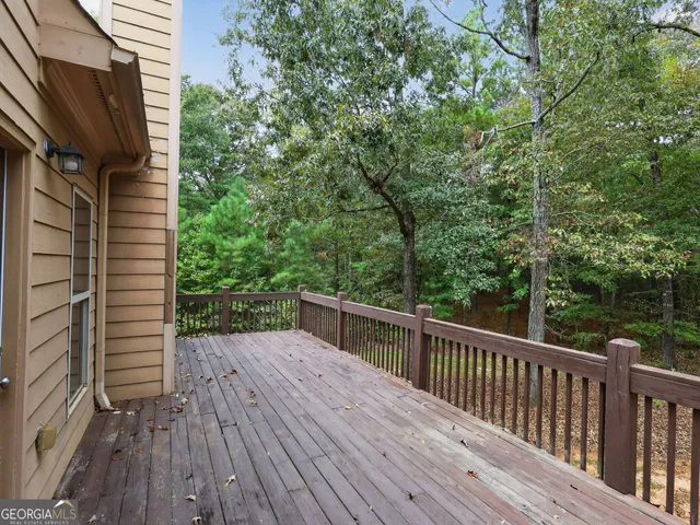 a view of deck with wooden floor and fence