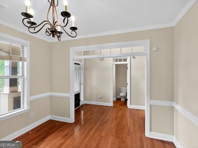 a view of an entryway with wooden floor