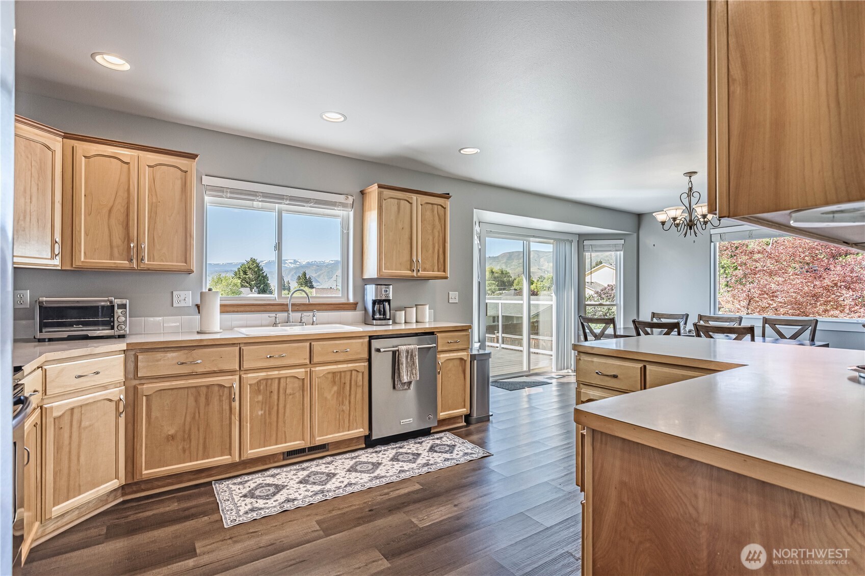 185 Fox Run Wenatchee, WA 98801 - Photo 16 of 39 a large kitchen with granite countertop a large counter top space a sink stainless steel appliances and cabinets