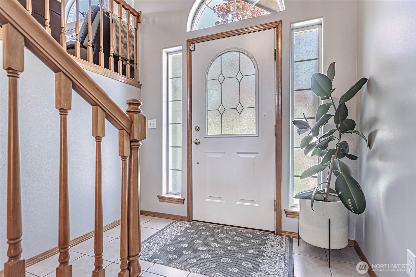 185 Fox Run Wenatchee, WA 98801 - Photo 7 of 39 a view of an entryway with wooden floor and a potted plant
