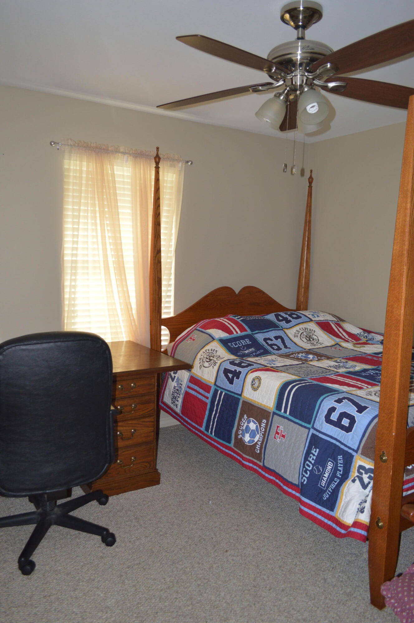 3939 Painter Branch Road Crestview, FL 32539 - Photo 16 of 35 a bedroom with a bed chair and window