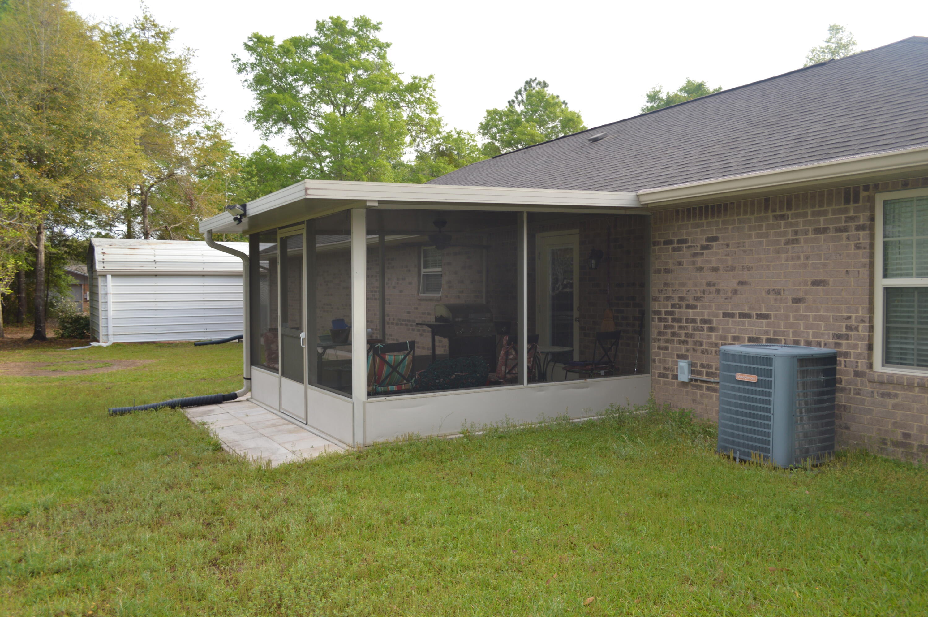3939 Painter Branch Road Crestview, FL 32539 - Photo 22 of 35 a view of a back yard of the house