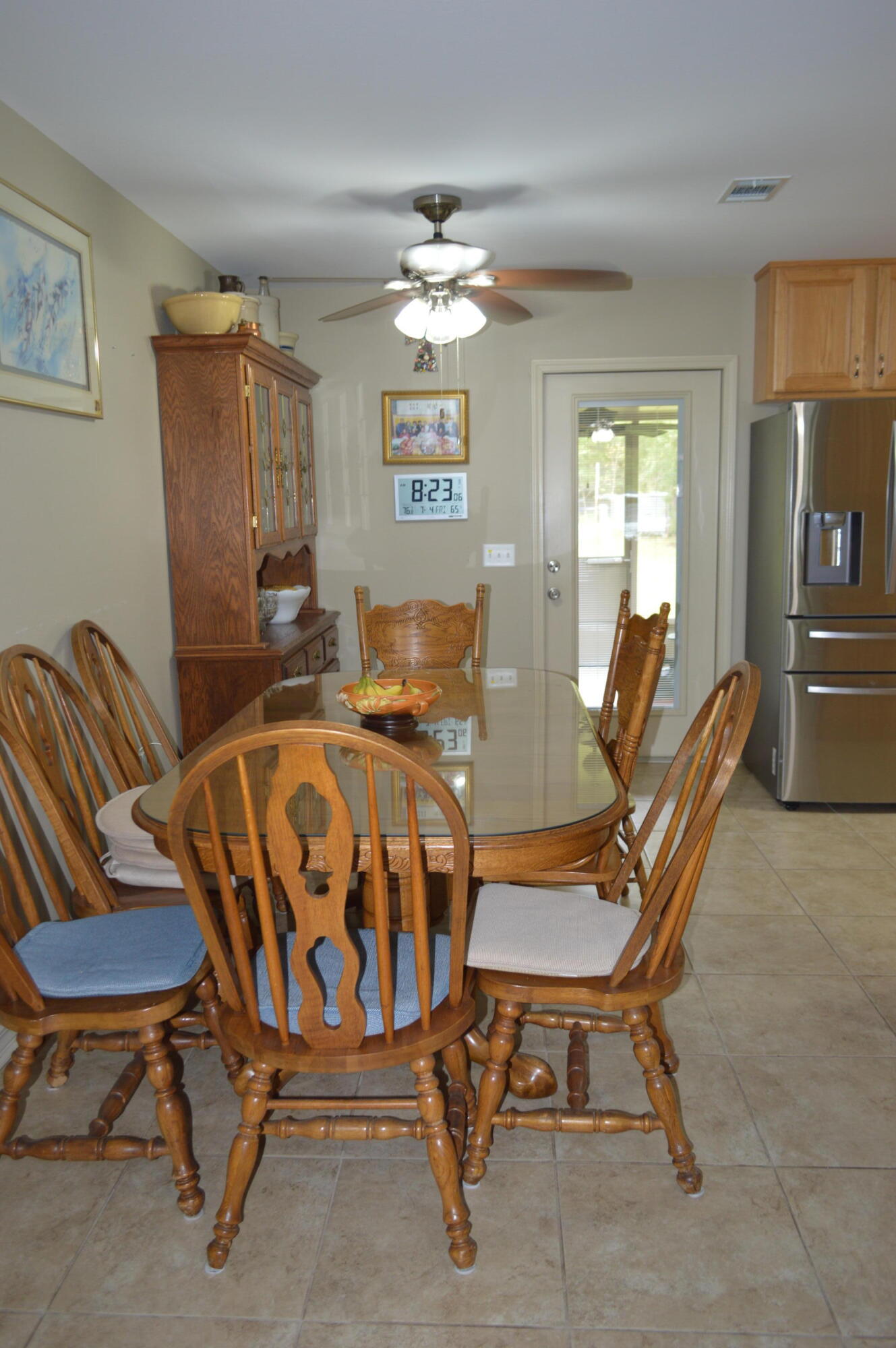 3939 Painter Branch Road Crestview, FL 32539 - Photo 6 of 35 a view of a dining room with furniture window and wooden floor