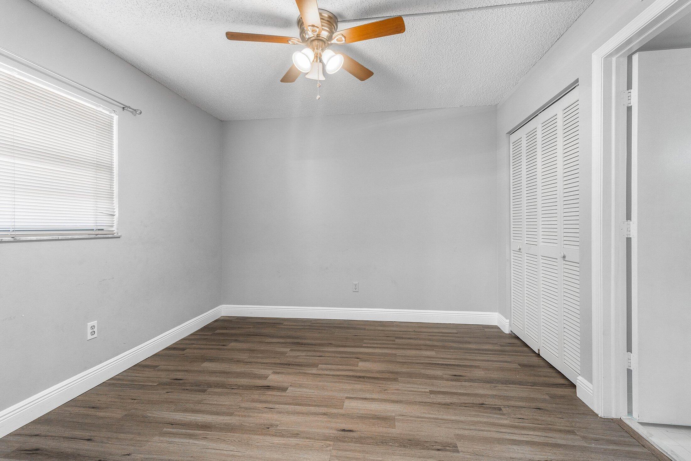 23395 Carolwood Lane, Unit 207 Boca Raton, FL 33428 - Photo 23 of 39 wooden floor in an empty room