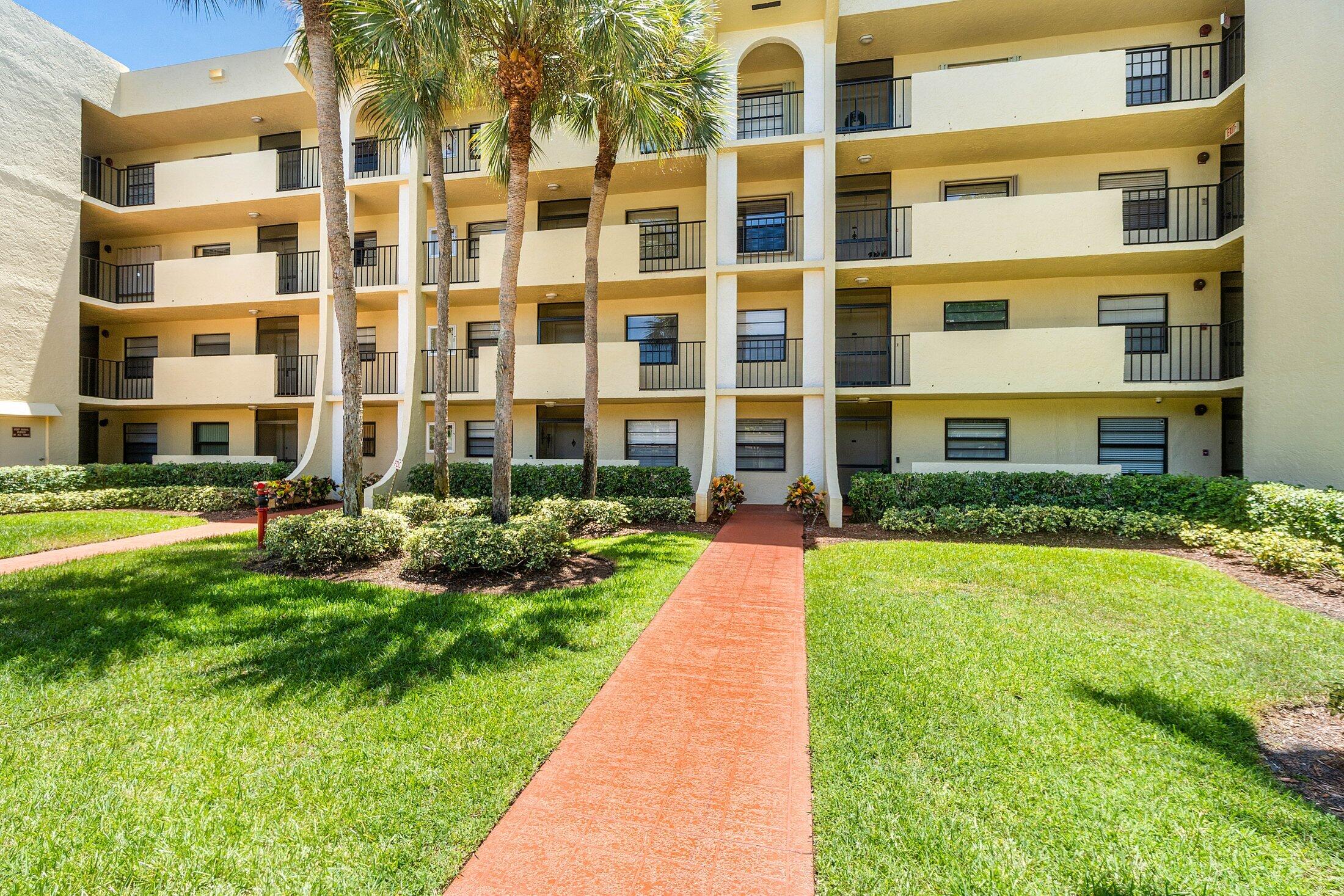 23395 Carolwood Lane, Unit 207 Boca Raton, FL 33428 - Photo 36 of 39 a front view of a building