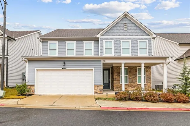 a front view of a house with yard