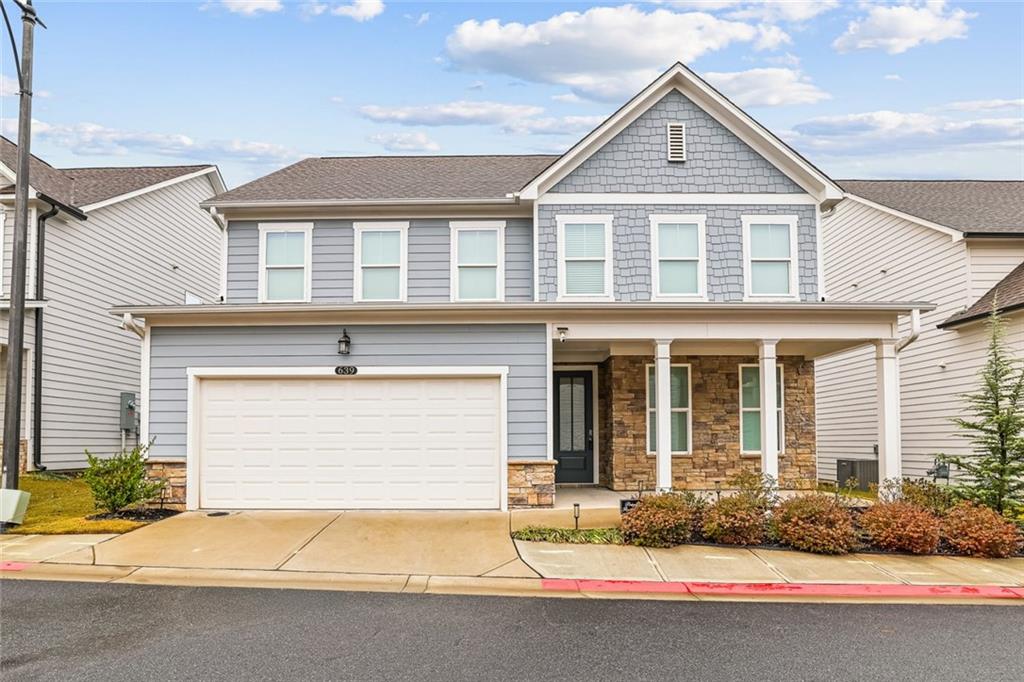 639 Tigers Eye Terrace Kennesaw, GA 30144 - Photo 1 of 36 a front view of a house with yard