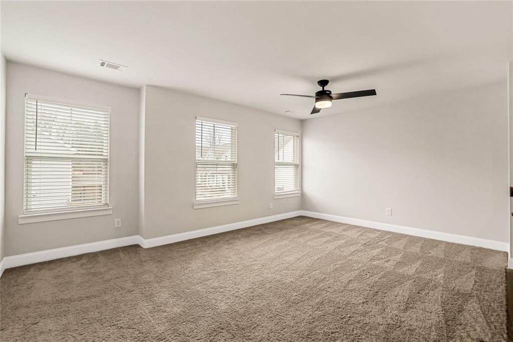 639 Tigers Eye Terrace Kennesaw, GA 30144 - Photo 20 of 36 a view of a livingroom with a ceiling fan and window