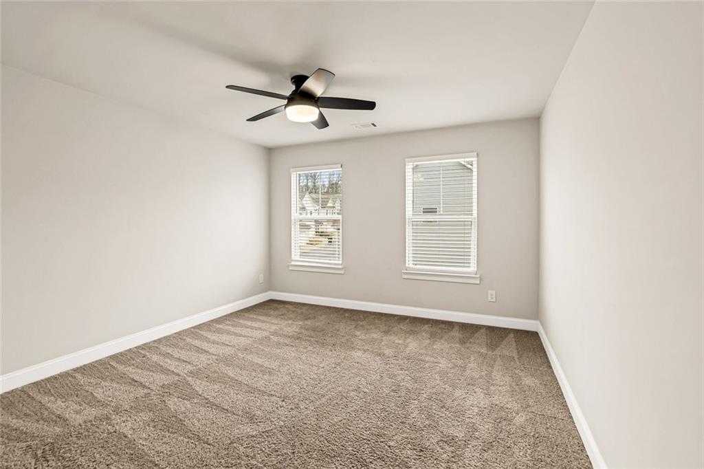 639 Tigers Eye Terrace Kennesaw, GA 30144 - Photo 21 of 36 a view of an empty room with a window