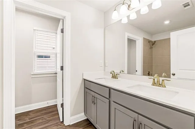a bathroom with a sink a vanity and a mirror