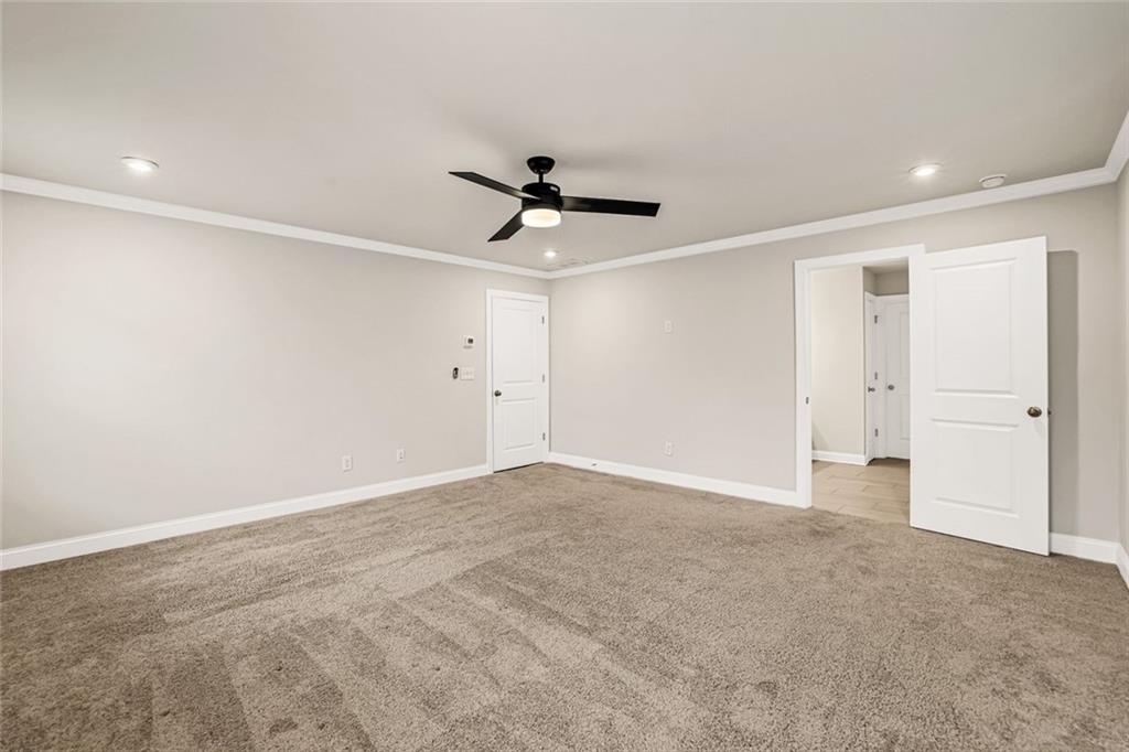 639 Tigers Eye Terrace Kennesaw, GA 30144 - Photo 29 of 36 a view of a livingroom with a ceiling fan