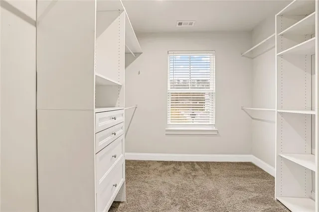 a view of walk in closet with window