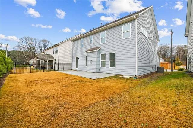a house view with swimming pool and porch
