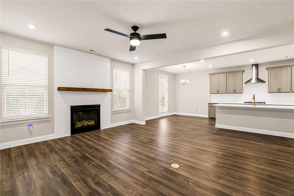 639 Tigers Eye Terrace Kennesaw, GA 30144 - Photo 4 of 36 a view of an empty room with a window and fireplace