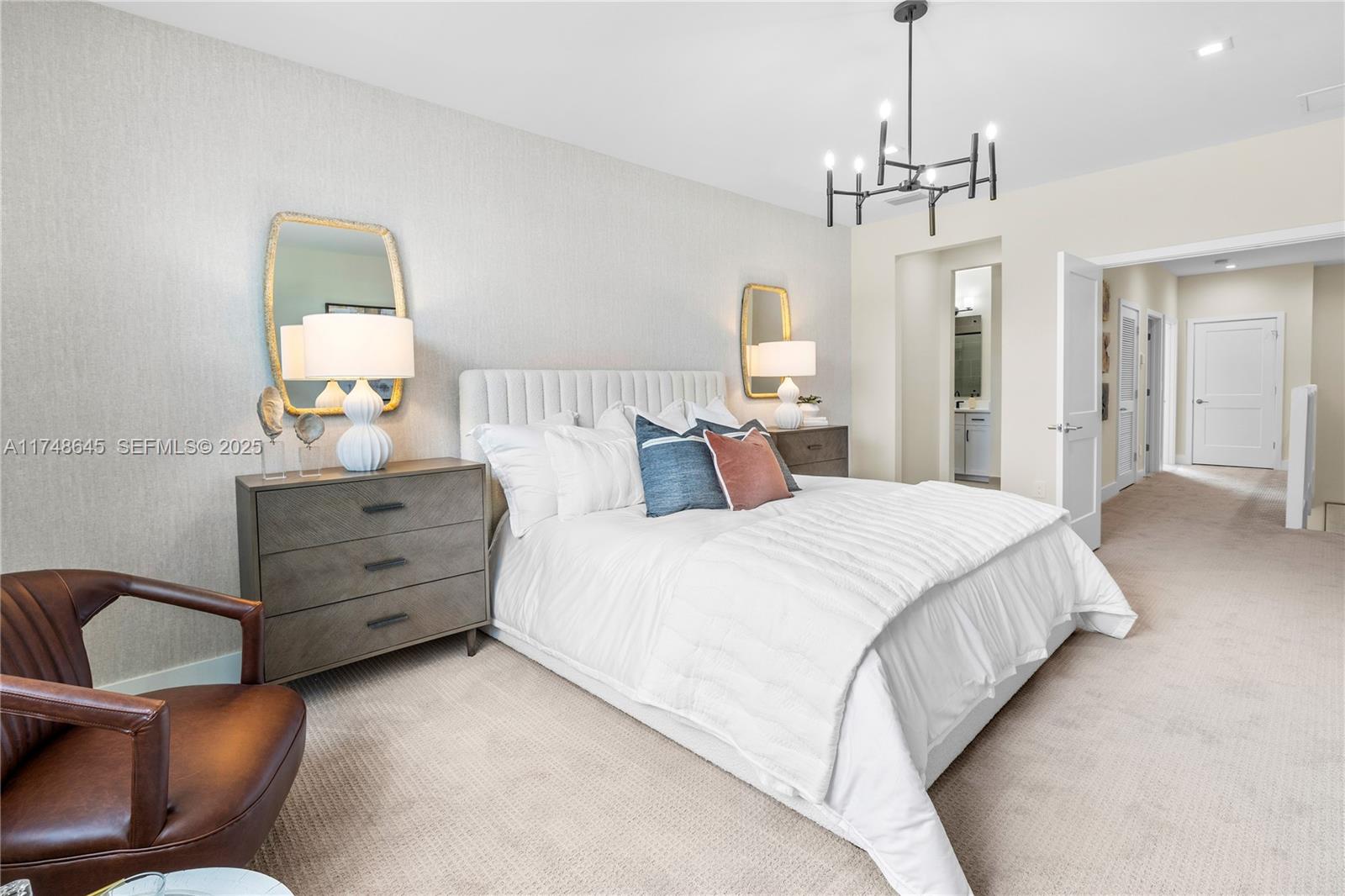 10951 Salt Bay Way Fort Myers, FL 33913 - Photo 20 of 34 a bedroom with a bed and a mirror