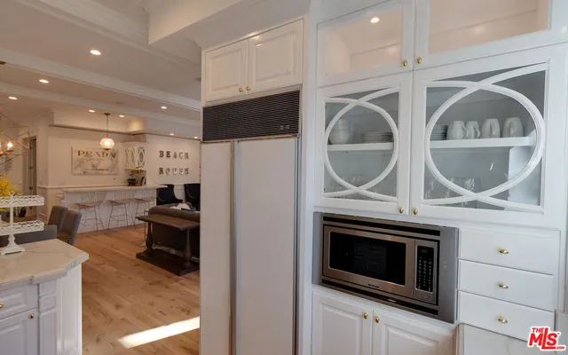 a living room filled with furniture windows and a table