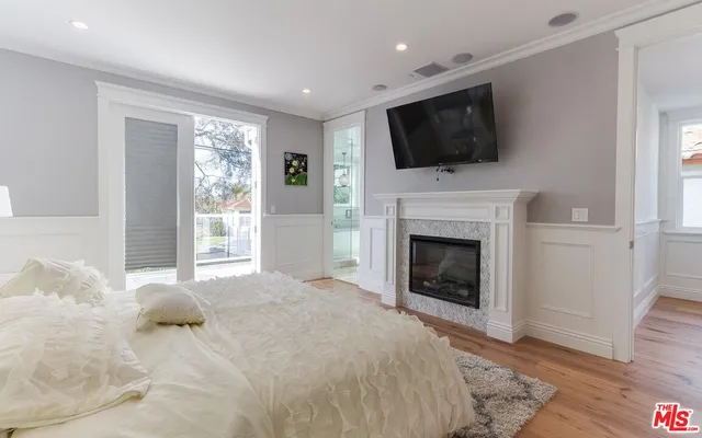 a bathroom with a tub sink shower and view