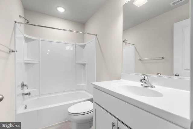 a bathroom with a sink a toilet and a bathtub