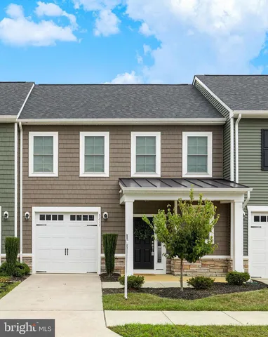 a view of a chairs and table in the yard
