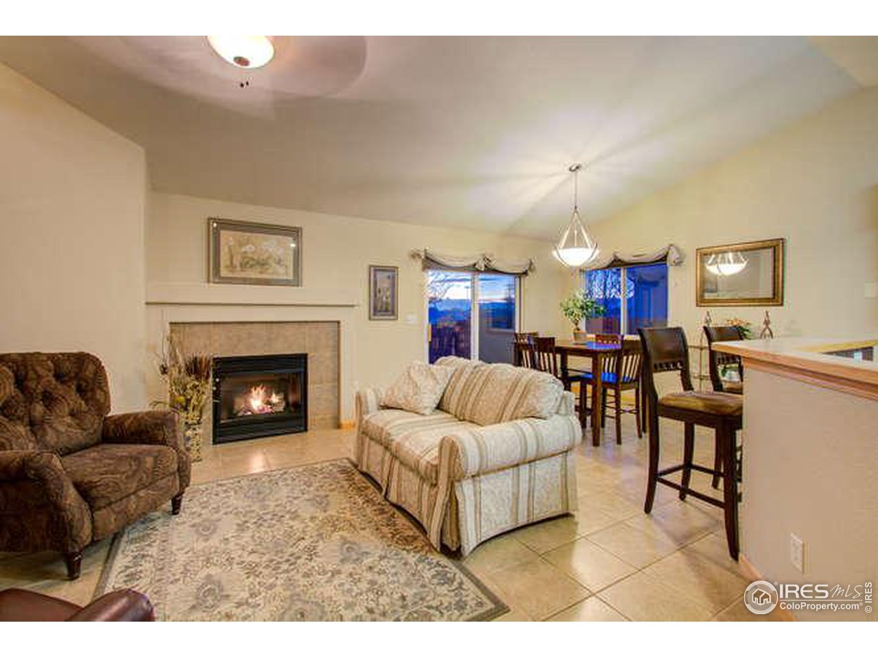 841 Durum Street Windsor, CO 80550 - Photo 12 of 24 a living room with furniture and a fireplace