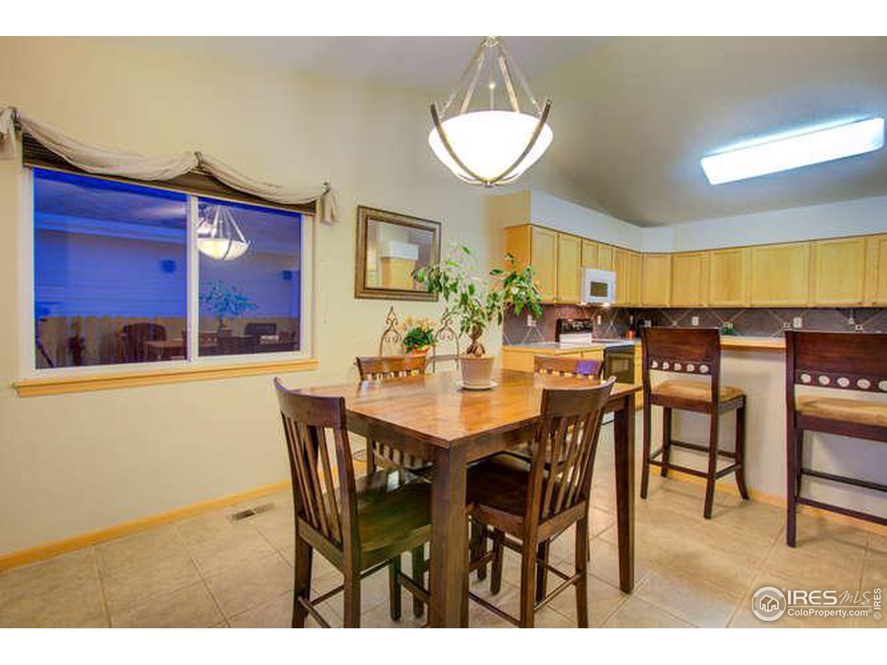 841 Durum Street Windsor, CO 80550 - Photo 15 of 24 a view of a dining room with furniture