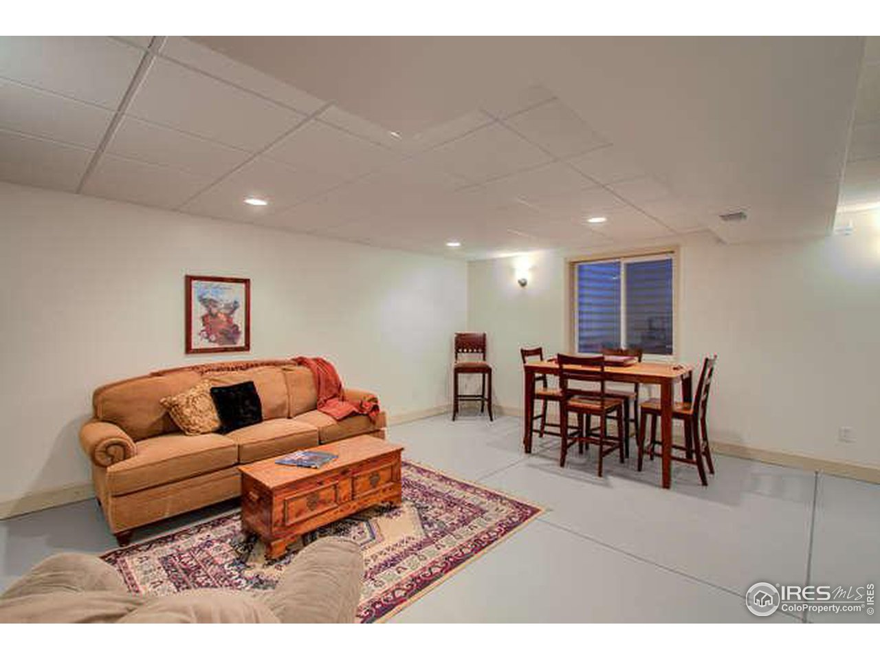 841 Durum Street Windsor, CO 80550 - Photo 21 of 24 a living room with furniture and a table