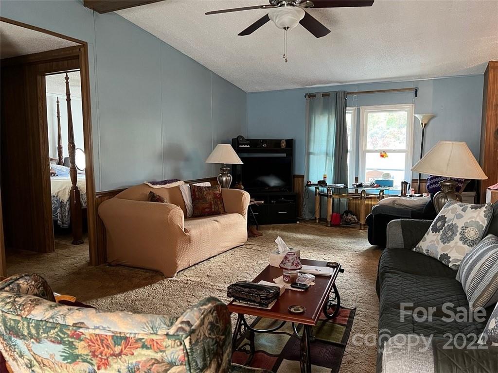396 Jacobs Road Bryson City, NC 28713 - Photo 11 of 43 a living room with furniture ceiling fan and a window