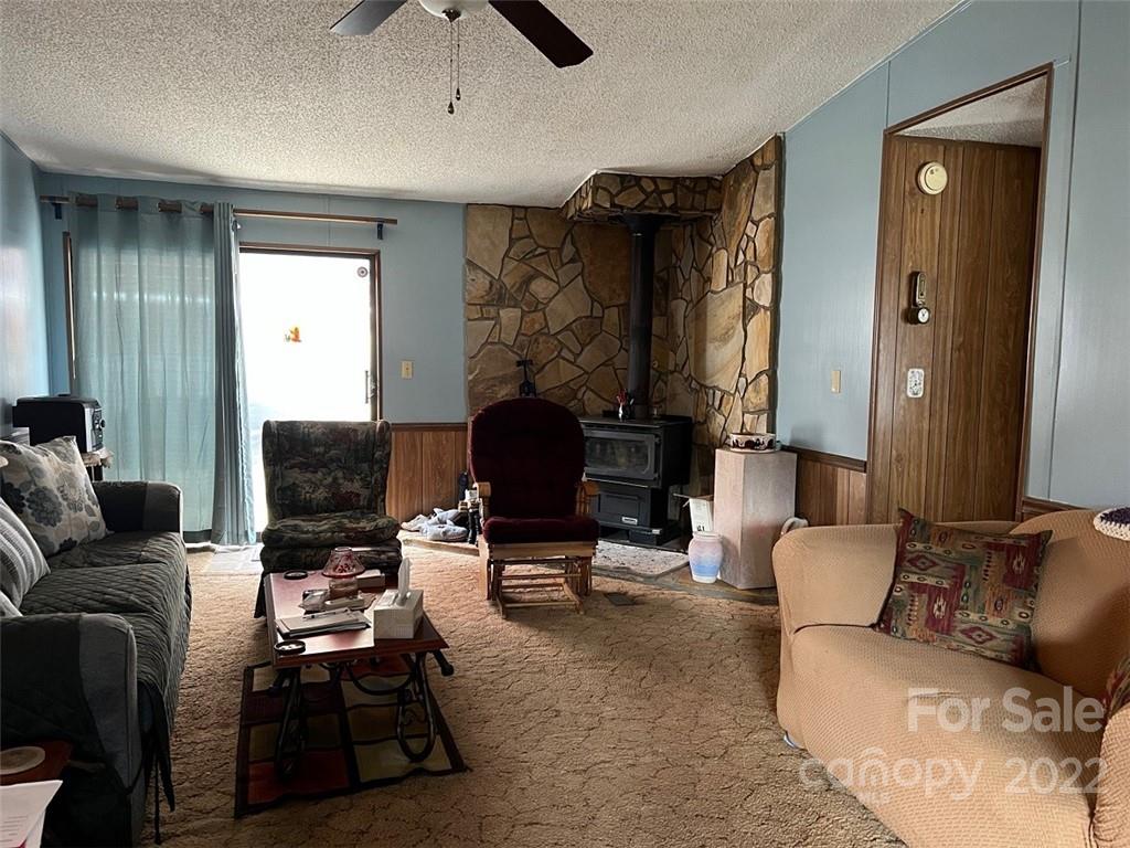 396 Jacobs Road Bryson City, NC 28713 - Photo 12 of 43 a living room with furniture and a fireplace